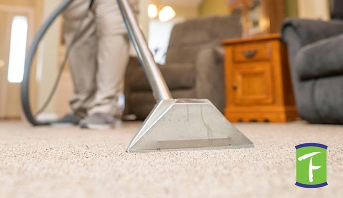 Professional worker removing stain from the carpet in Sarasota